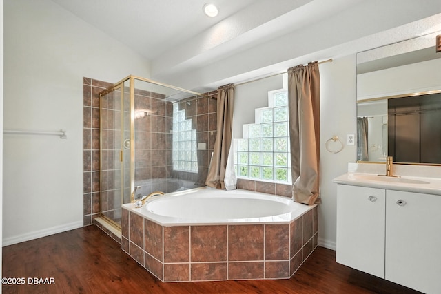 918 Brookridge Ln, Ormond Beach, FL 32174 - bathroom featuring a garden tub, a stall shower, vanity, and wood finished floors