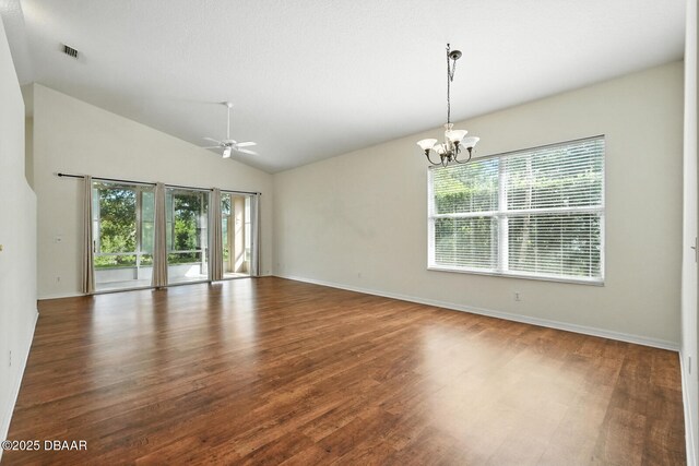 918 Brookridge Ln, Ormond Beach, FL 32174 - spare room featuring plenty of natural light, wood finished floors, a chandelier, a ceiling fan, and lofted ceiling