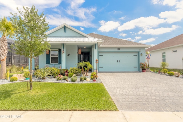 view of front of property with a garage and a front yard