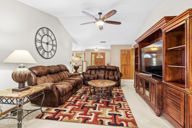 living room with lofted ceiling, light carpet, and ceiling fan