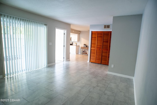 2 Springwood Sq, Port Orange, FL 32129 - empty room featuring baseboards