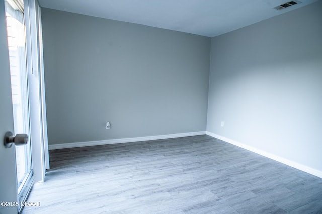 2 Springwood Sq, Port Orange, FL 32129 - empty room with wood finished floors and baseboards