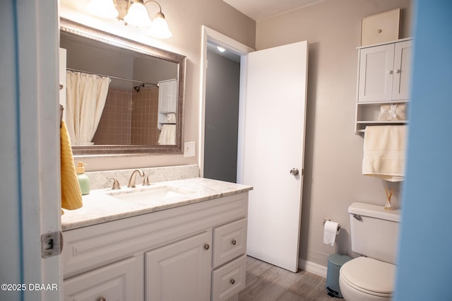 2 Springwood Sq, Port Orange, FL 32129 - full bathroom with wood finished floors, toilet, vanity, baseboards, and a shower with curtain