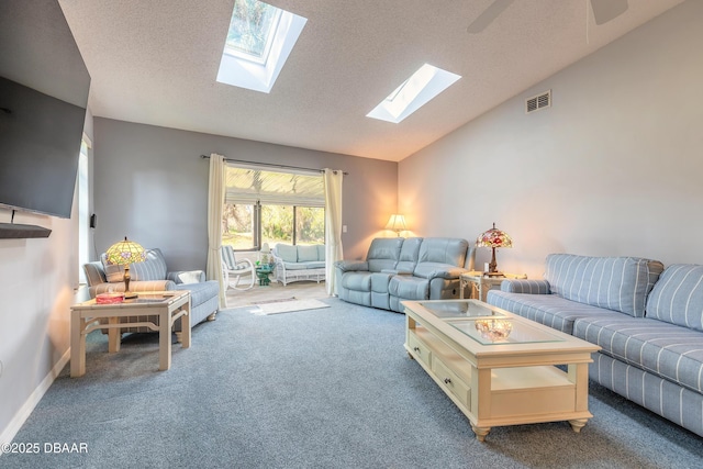 living room with a textured ceiling, carpet floors, visible vents, baseboards, and vaulted ceiling