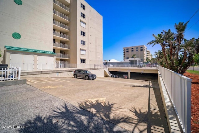 4505 S Atlantic Ave Unit 605, Ponce Inlet, FL 32127 - view of apartment building / complex with uncovered parking