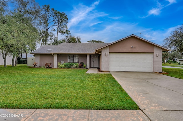 ranch-style home featuring a garage, brick siding, concrete driveway, stucco siding, and a front yard