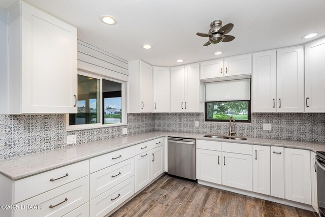 685 Middlebury Loop, New Smyrna Beach, FL 32168 - kitchen featuring dishwasher, a sink, backsplash, a ceiling fan, and white cabinetry
