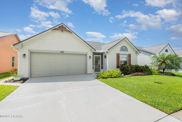 685 Middlebury Loop, New Smyrna Beach, FL 32168 - ranch-style house featuring driveway, an attached garage, and a front lawn