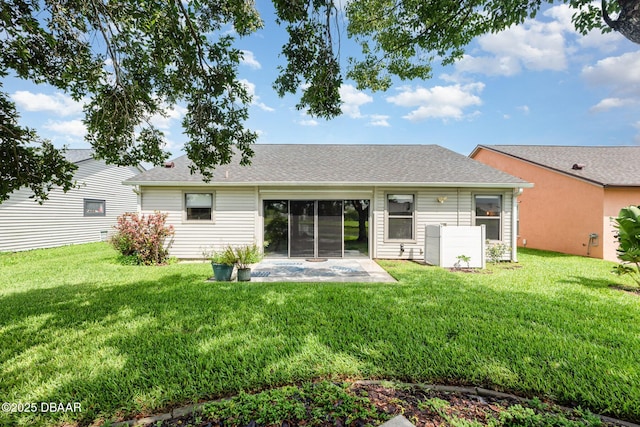 685 Middlebury Loop, New Smyrna Beach, FL 32168 - rear view of house with a patio area, a yard, and roof with shingles