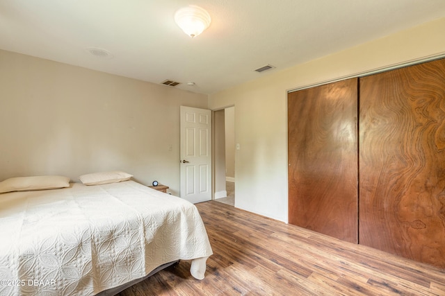 121 Palm Dr, Daytona Beach, FL 32117 - bedroom featuring wood finished floors and a closet