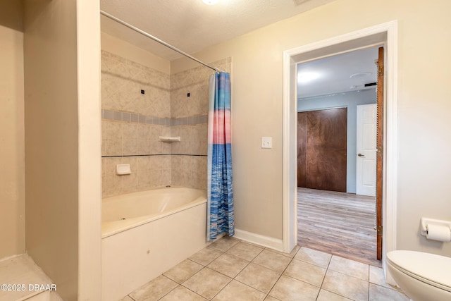 121 Palm Dr, Daytona Beach, FL 32117 - bathroom with tile patterned flooring, toilet, shower / bath combo, and baseboards