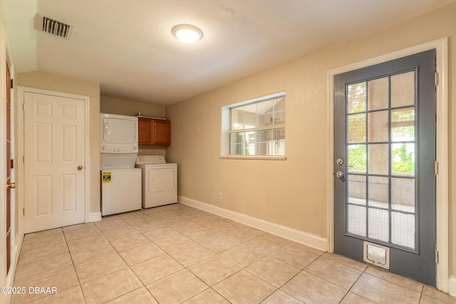 121 Palm Dr, Daytona Beach, FL 32117 - laundry room with washer / clothes dryer, cabinet space, and plenty of natural light
