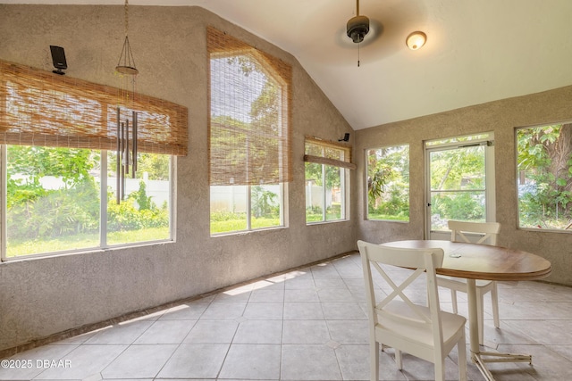 121 Palm Dr, Daytona Beach, FL 32117 - sunroom / solarium with lofted ceiling, tile patterned flooring, and a textured wall