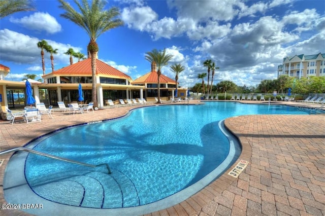 view of swimming pool featuring a patio area and a gazebo