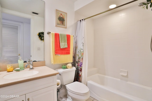 full bathroom featuring tile patterned floors, vanity, shower / bath combination with curtain, and toilet