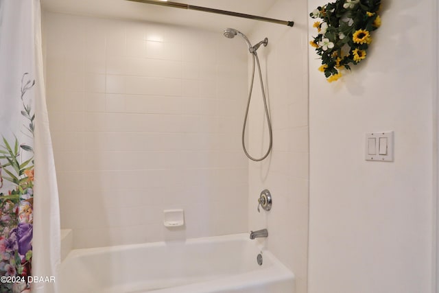 bathroom with shower / tub combo with curtain