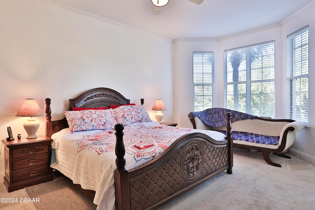 carpeted bedroom featuring crown molding, multiple windows, and ceiling fan