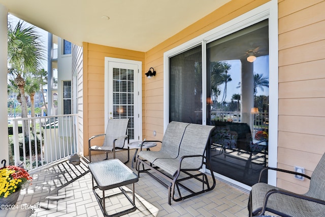 view of patio featuring a balcony