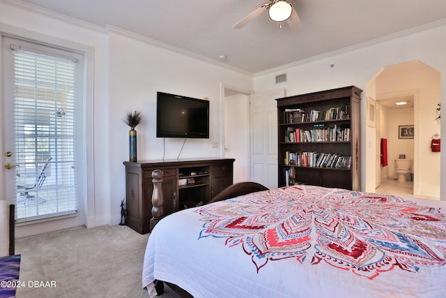 carpeted bedroom featuring ceiling fan, crown molding, and connected bathroom