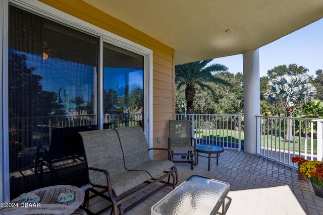 view of patio featuring a balcony