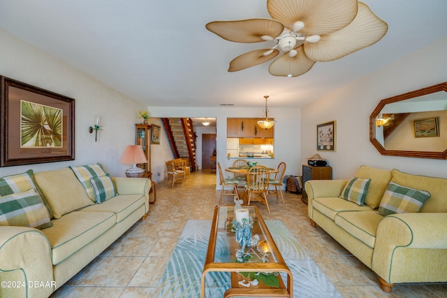 tiled living room with ceiling fan