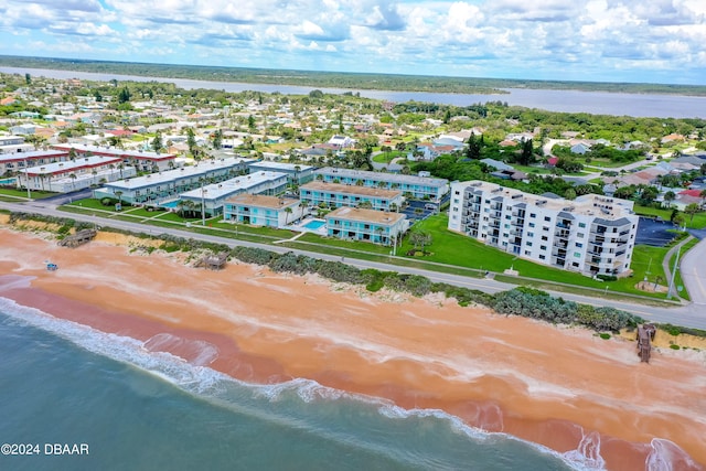 bird's eye view featuring a view of the beach and a water view