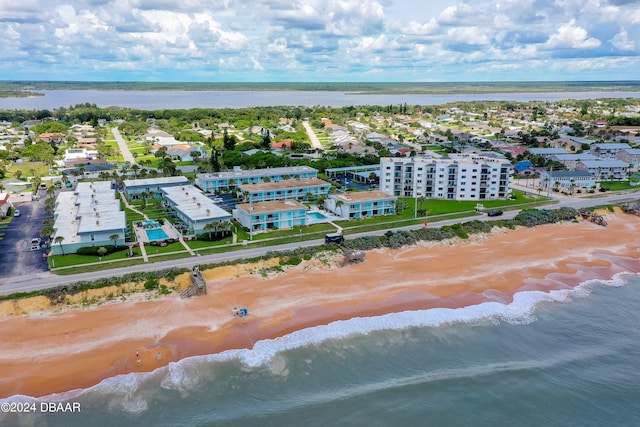 drone / aerial view featuring a view of the beach and a water view