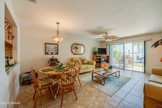 tiled living room with ceiling fan