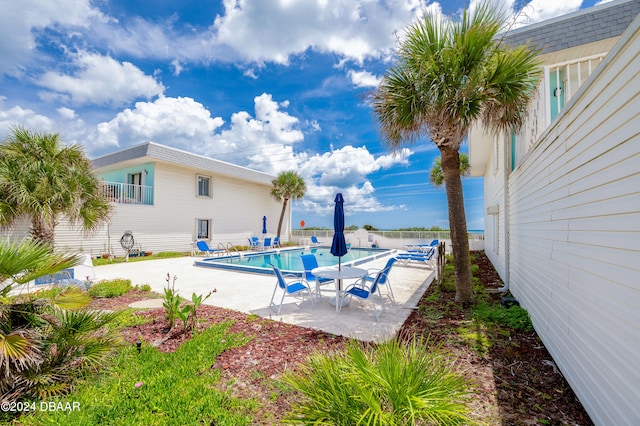 view of pool featuring a patio