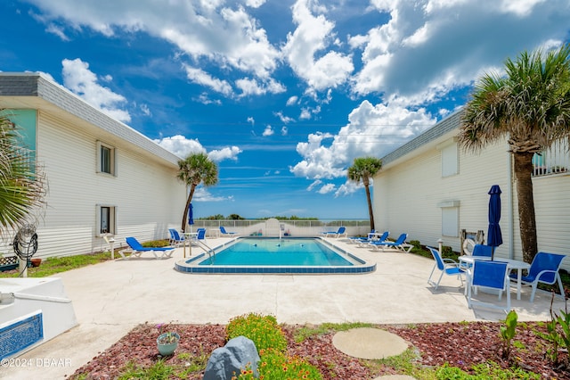 view of swimming pool with a patio area