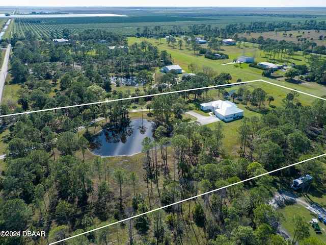 aerial view with a rural view and a water view