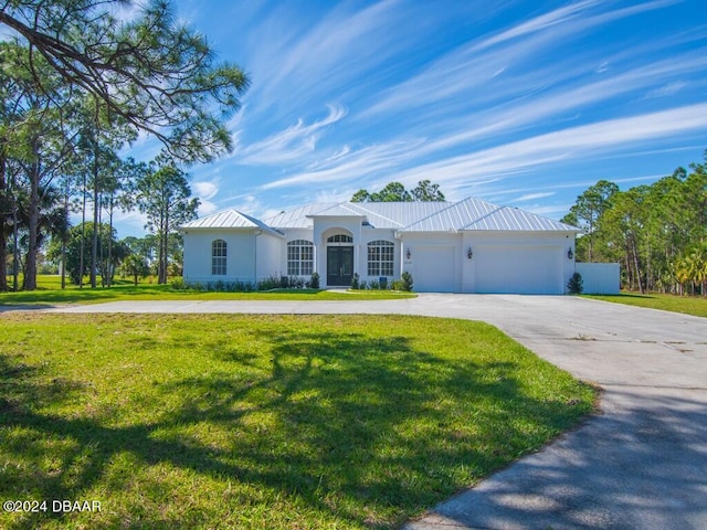 ranch-style home with a front lawn and a garage