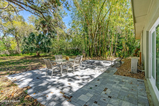 view of patio with an outdoor fire pit