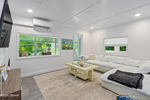 living room with hardwood / wood-style floors and an AC wall unit