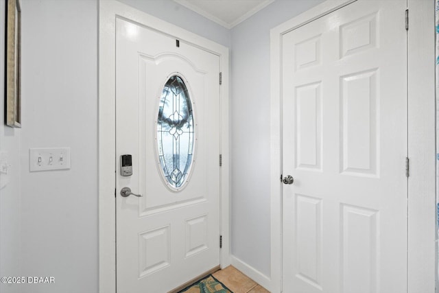 foyer featuring crown molding and tile patterned floors