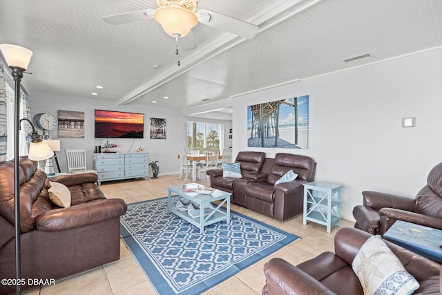 living room with ceiling fan, beamed ceiling, and light tile patterned floors