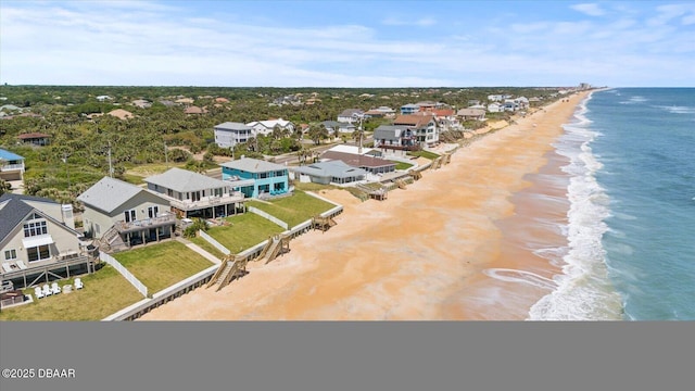 bird's eye view featuring a beach view and a water view