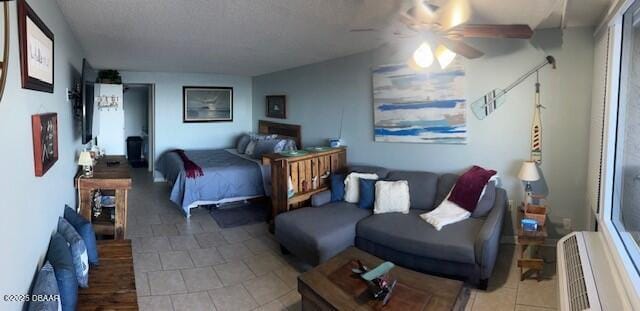 tiled bedroom with ceiling fan and a wall mounted AC