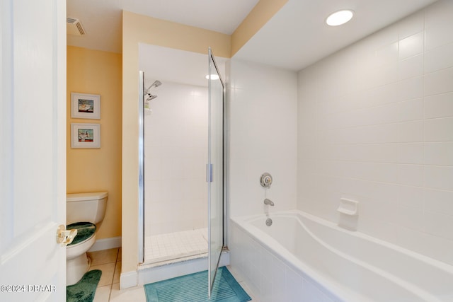 bathroom with tile patterned floors, toilet, and independent shower and bath