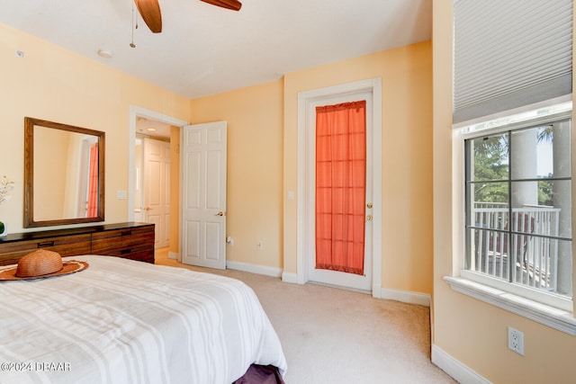 bedroom featuring light carpet and ceiling fan