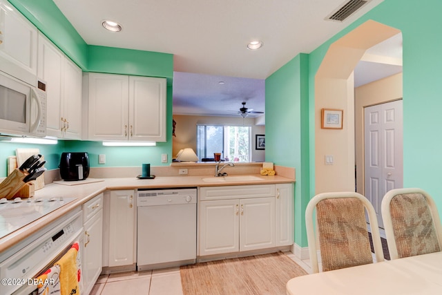 kitchen with light tile patterned flooring, white cabinetry, white appliances, and ceiling fan