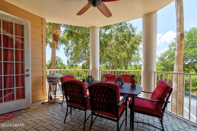 sunroom / solarium featuring a wealth of natural light and ceiling fan