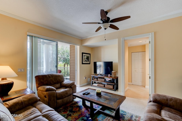 living room featuring a textured ceiling, light carpet, ceiling fan, and crown molding