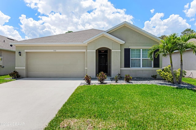 single story home with an attached garage, stucco siding, driveway, and a front yard