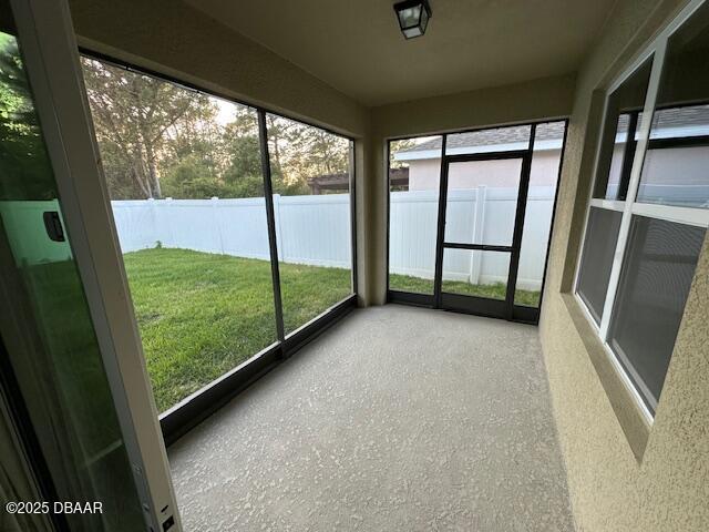 unfurnished sunroom featuring plenty of natural light