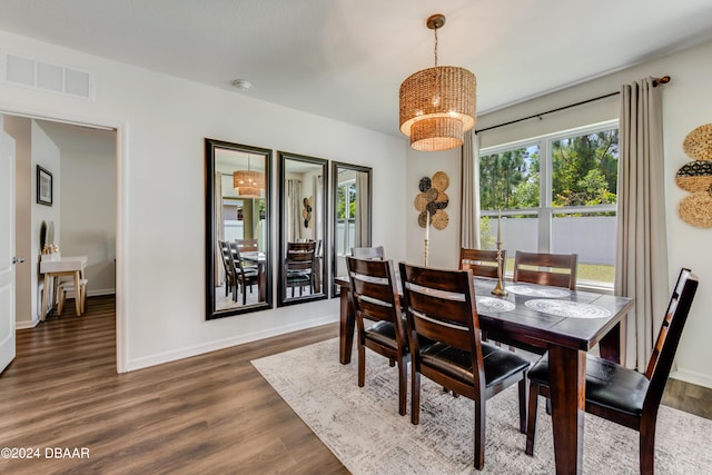 dining room with baseboards, dark wood-style flooring, and visible vents