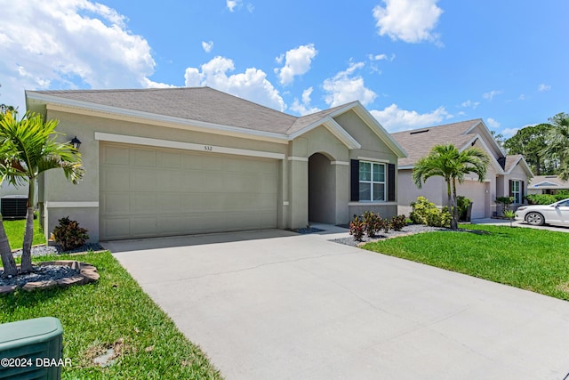 ranch-style house with driveway, central AC unit, a front lawn, an attached garage, and stucco siding