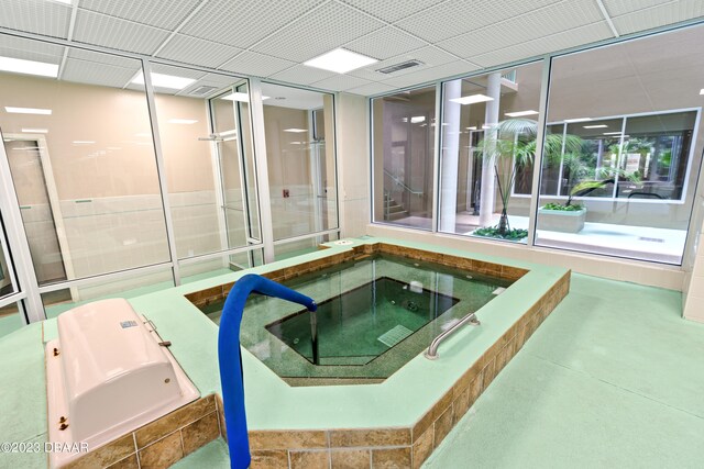 view of swimming pool featuring an indoor in ground hot tub