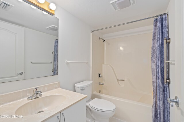 full bathroom featuring vanity, toilet, and shower / bathtub combination with curtain