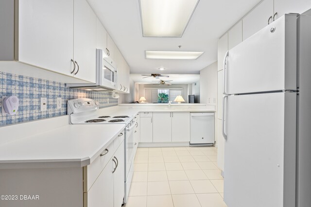 kitchen with light tile patterned floors, decorative backsplash, white cabinets, white appliances, and ceiling fan